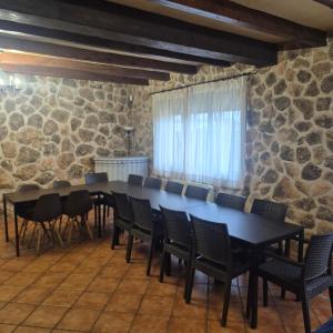 a conference room with a long table and chairs at Finca Don Sancho by Mayne in Lillo +36 photos