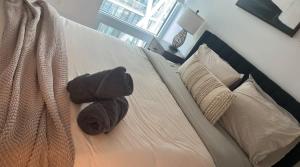 a stuffed animal sitting on top of a bed at Sleep 2 guests cozy couch in Port Hope