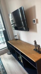 a kitchen with a wooden counter top in a room at Sleep 2 guests cozy couch in Port Hope