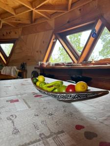a bowl of fruit sitting on top of a table at Domo Conguillio, Salto Truful Truful in Melipeuco