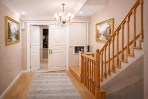 a hallway with a staircase and a chandelier at valide-maide hotel in Istanbul