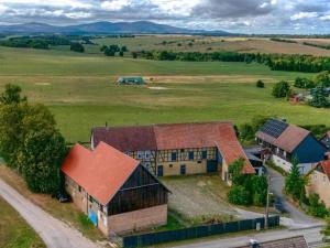 an aerial view of a farm with buildings at Brocken-Blick in Hüttenrode