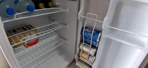 an open refrigerator with some food and milk at Suites del Pacífico in Salinas