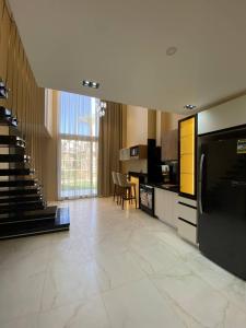 a large room with a kitchen with a large appliance at Jasmine Resort Complex in Sharm El Sheikh