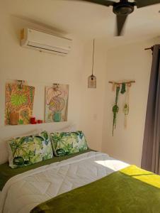 a bedroom with a bed and a air conditioner at Casa Monstera Bahia in Naranjo +88 photos
