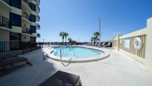 a swimming pool on the side of a building at Steps to the beach and amazing views! in Panama City Beach