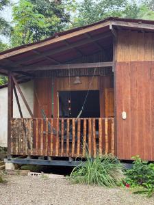 a wooden cabin with a porch and a balcony at Casa Selva in El Valle
