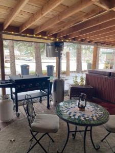 a patio with a ping pong table and a ping pong table at Lake Room in Sandpoint