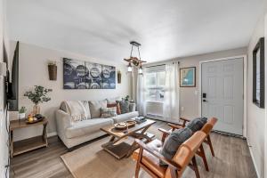a living room with a couch and a table at Newly renovated-across the street from Von Stiehl! in Algoma