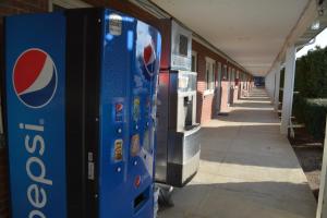 a pepsi vending machine sitting outside of a building at WYE Motor Lodge Duncansville - Altoona in Duncansville
