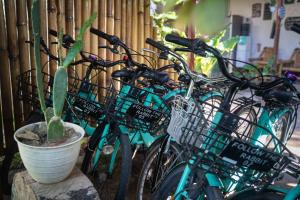 a group of bikes parked next to a fence at Follow The Rabbit Bungalow in Gili Islands