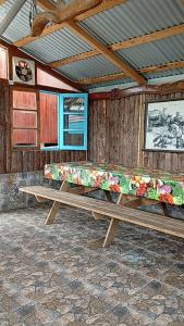 a wooden bench sitting in a room at Loft in El Tabo