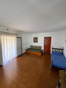 a large room with a bed and a table at Bendecida in San Antonio de Arredondo