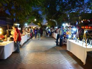 a group of people at an outdoor market at night at Floor 17 City views Americana & Chapultepec in Guadalajara +60 photos