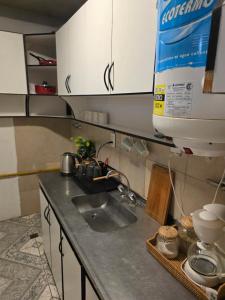 a kitchen counter with a sink and a mixer at Departamento dos dormitorios en 3er piso por escaleras in Chajarí