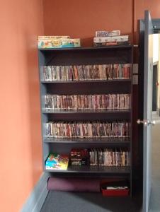a book shelf filled with dvds at Australia Hotel Fremantle in Fremantle +23 photos