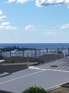 a view of the ocean from the roof of a building at Sea La Vie in Shellharbour