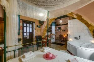 a large bathroom with a tub and a sink at Ifigenia Lux MAISONETTE in oldtown and Villas in theriso vilage 14 km outside of chania in Chania +71 photos