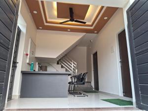 a coffered ceiling with a skylight in a house at Vamika Palace in Ayodhya