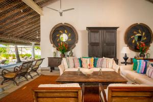 a living room with a couch and a table at Samudra Beach Villa in Habaraduwa Central