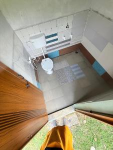 an overhead view of a bathroom with a toilet at Calm coorg tent in Madikeri