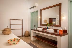a bathroom with two sinks and a large mirror at Samudra Beach Villa in Habaraduwa Central +44 photos