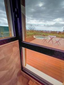 a view from a window of a patio with a pool at Sagar Réunion in Saint-Paul