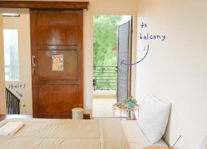 a bedroom with a bed and a door at MiTS in Bandung