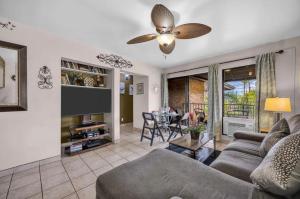 a living room with a couch and a ceiling fan at Best Deal and Epic Location 2bd 2BA Ocean View in Kihei +29 photos
