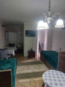 a living room with a couch and a table at Boutique hotel in Poti