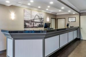 a lobby with a reception desk with a ferris wheel at Elizabeth Oceanfront Suites, an Ascend Collection Hotel in Newport +36 photos