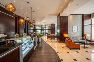 a lobby of a hotel with a fish tank at Doha Central Plaza Hotel in Doha
