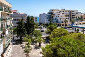 an aerial view of a city with trees and buildings at Alma Mare in Crotone