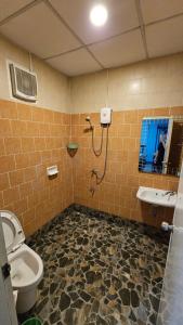 a bathroom with a shower and a toilet and a sink at Blueplace บลูเพลส in Ban Talat Rangsit