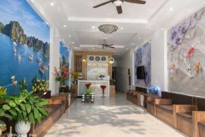 a lobby of a mosque with paintings on the walls at Ngọc Tùng Hotel in Ha Long