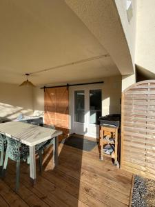 a dining room with a table and a table sidx sidx at À la clef des champs in Chauray