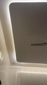a window in the ceiling of an airplane at Shree residences in Vrindāvan