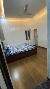 a bedroom with a bed in a room at Shree residences in Vrindāvan