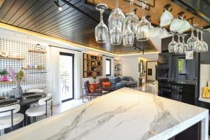 a kitchen and living room with a marble counter top at Arawan - Boutique Art Hotel - Tannourine in Batroûn