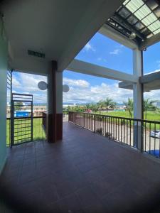 a balcony with a view of a field at AeroHomesuites Tawau in Tawau