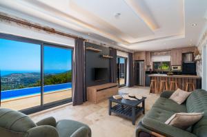 a living room with a view of the ocean at Villa Elvin in Kalkan
