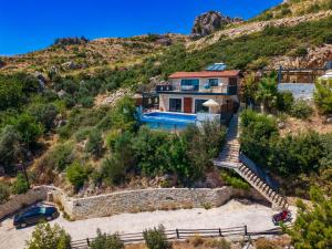 a house on a hill with a staircase at Villa Elvin in Kalkan