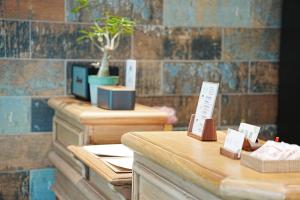 a row of wooden tables with signs on them at 吾庭文旅電梯民宿 WuTing Stay in Hualien City +84 photos