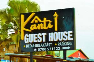 a sign for a guest house in front of a building at Kanti Guest House, Arua in Arua