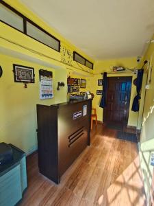 a room with a kitchen with a counter in a room at DHARAMSHALA inn MUNSYARI in Munsyari