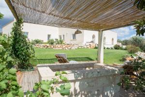 an external view of a house with a pergola at Agriturismo Spirdo in Ruffano