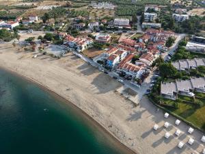 an aerial view of a beach with buildings and the water at Golden Beach, Gerakini in Gerakini