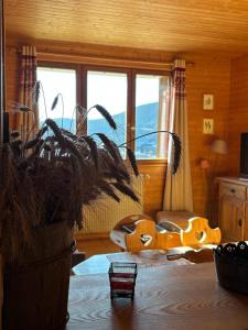 a room with a room with a bed and windows at La Moraine in Villard-de-Lans