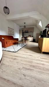 a living room with a couch and a table at Appartement Centre ville Le blanc in Le Blanc