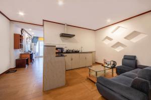 a living room with a couch and a table at A25 Hotel - 46 Châu Long in Hanoi